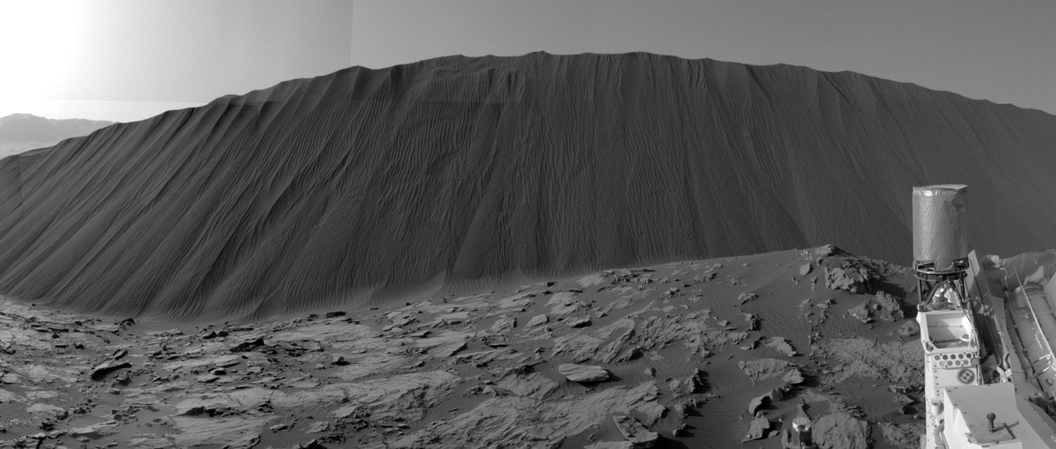 This view from NASA's Curiosity Mars Rover shows the downwind side of "Namib Dune," which stands about 13 feet (4 meters) high. The site is part of Bagnold Dunes, a band of dark sand dunes along the northwestern flank of Mars' Mount Sharp.

The component images stitched together into this scene were taken with Curiosity's Navigation Camera (Navcam) on Dec. 17, 2015, during the 1,196th Martian day, or sol, of the rover's work on Mars. (NASA/JPL-Caltech)