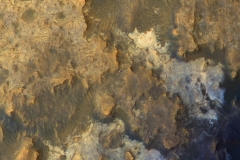 A view from NASA's Mars Reconnaissance Orbiter on April 8, 2015, catches sight of NASA's Curiosity Mars rover passing through a valley called "Artist's Drive" on the lower slope of Mount Sharp.

The image is from the orbiter's High Resolution Imaging Science Experiment (HiRISE) camera. It shows the rover's position after a drive of about 75 feet (23 meters) during the 949th Martian day, or sol, of the rover's work on Mars.

North is toward the top. The rover's shadow extends toward the right. The view in this image covers an area about 550 yards (500 meters) across. (NASA/JPL-Caltech/Univ. of Arizona)
